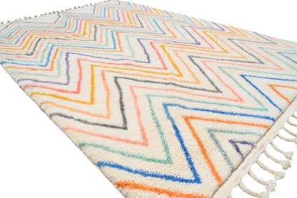 Full angled shot of a Beni Ourain Moroccan rug with multicoloured zigzags.