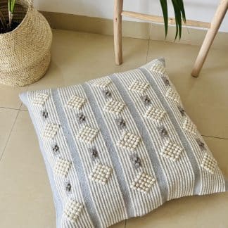 Moroccan Floor Pillow - Light Grey with White on a marble floor.