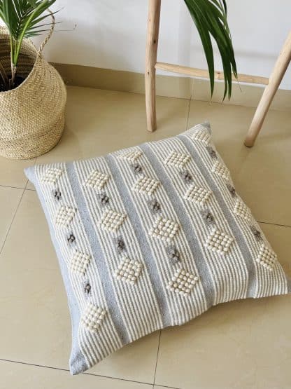 Moroccan Floor Pillow - Light Grey with White on a marble floor.