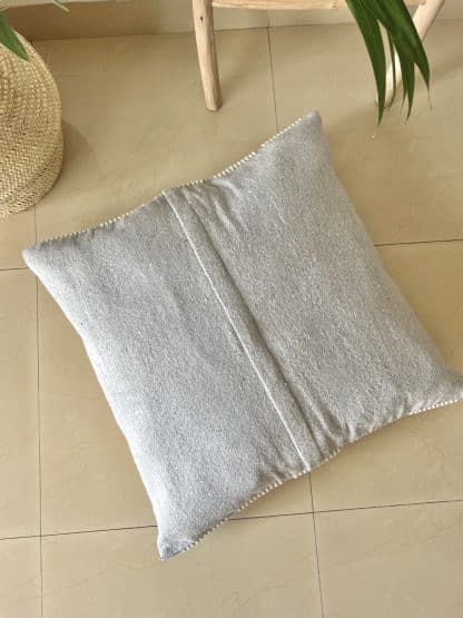 Upside down Moroccan Floor Pillow - Light Grey with White on a marble floor.