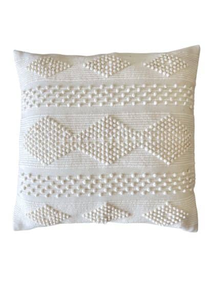 Moroccan floor pillow made of off-white wool with little woollen balls arranged in geometric designs on a white background.