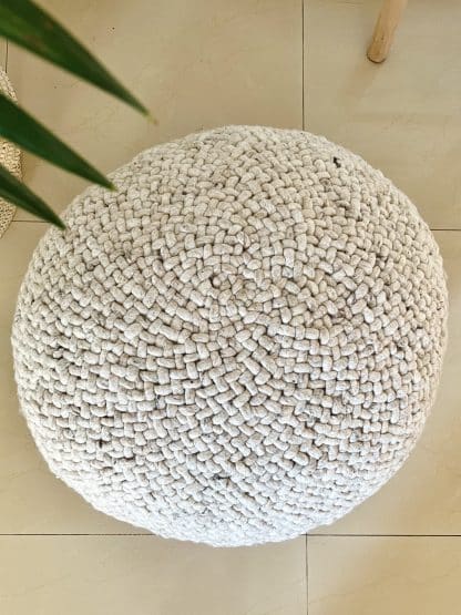Aerial shot of a beige Braided Pouf.