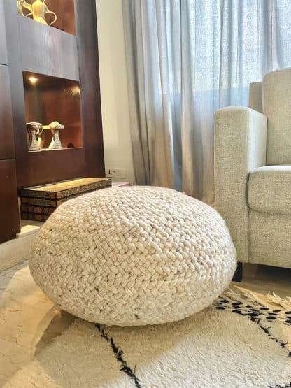 Beige Braided Pouf in a living room.