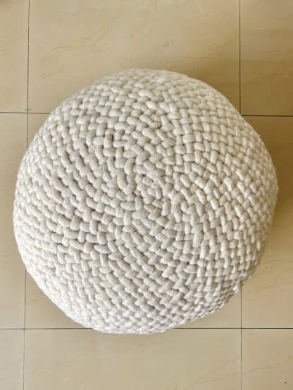 Aerial shot of an ivory Braided Pouf.