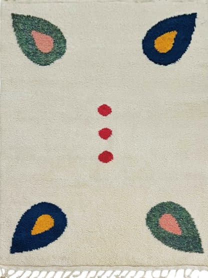 Full shot of a Beni Ourain Moroccan Rug created in collaboration with White Otter Design Co. It features a cream base with green and blue petals, and red dots.